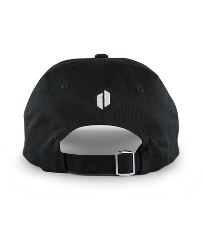 Black washed cotton Puffco "Where's The Hash" hat, rear view, with white embroidered logo and silver buckle.